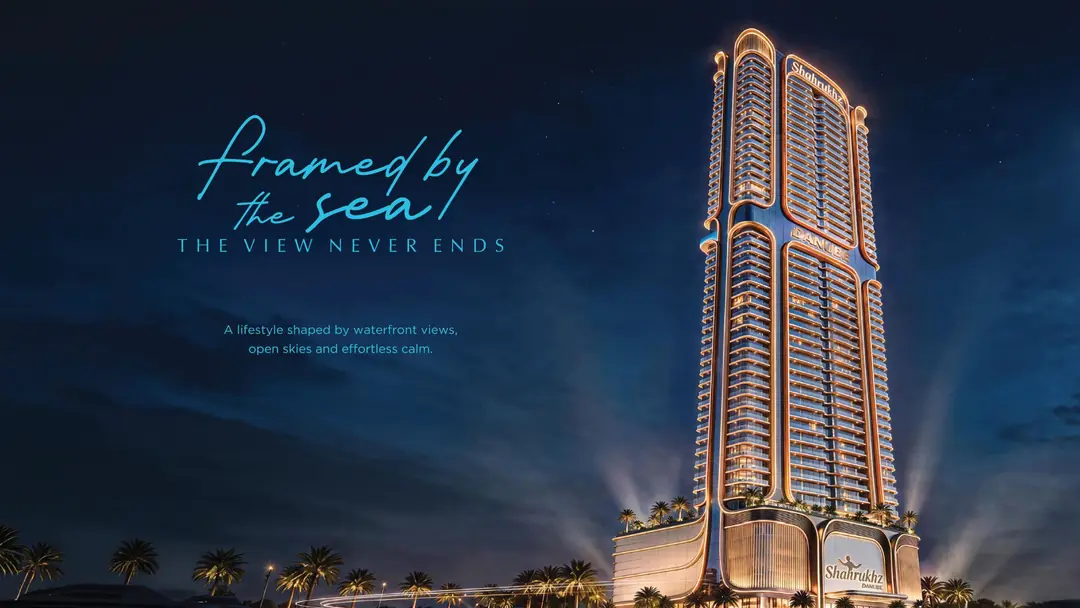 Shahrukhz Residences tower lit up at night in Dubai Maritime City